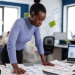 black businesswoman checking work multiethnic colleagues startup agency diverse team business people analyzing company financial reports from computer start up successful corporate professi