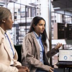 women leaders strategizing corporate office focused growth