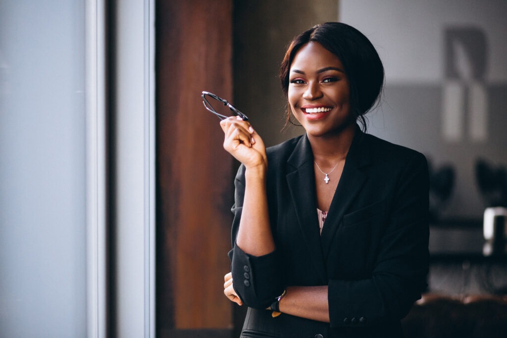 african american business woman by window